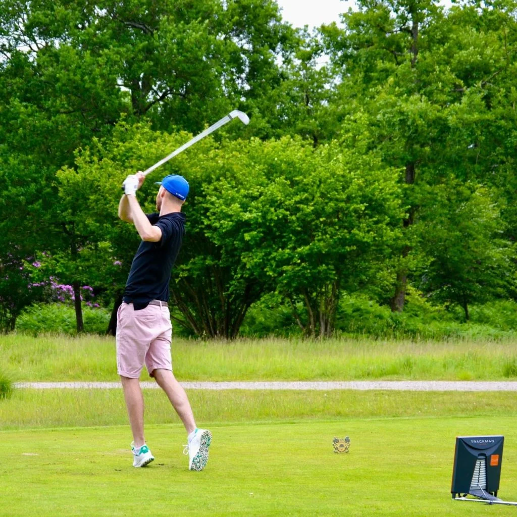 Golfer using TrackMan simulator at Flyte Golf